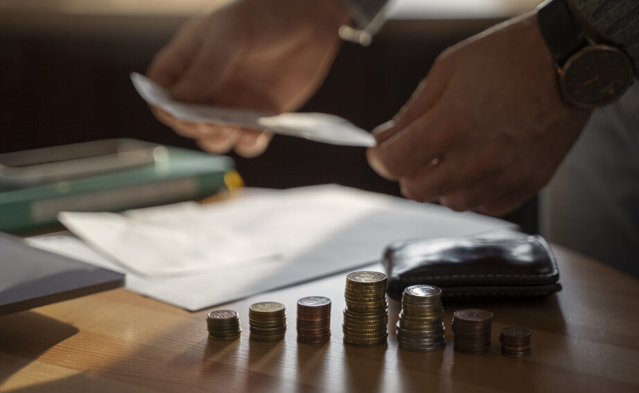 close up coins saved energy crisis expenses